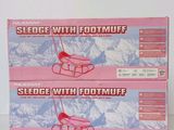 two boxes of footmuff on a table with a mountain in the background