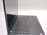 a laptop computer that is open on a white surface