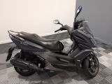 a picture of a motorcycle parked on a checkered floor
