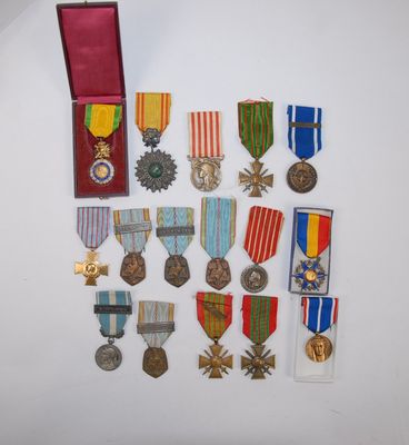 several medals and medals are displayed on a white surface