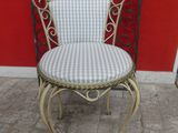 wrought iron chair with checkered seat and back