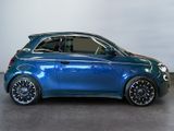 a picture of a blue smart car parked in a showroom