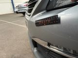 a close up of a car with a sticker on the front of it