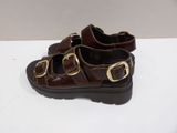 brown leather sandals with buckles and buckles on each side