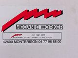 a sign that says mechanic worker on the back of a truck