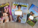 three magazines on a table with a sticker on the cover