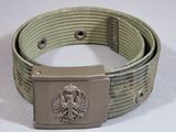 a belt with a metal buckle on it on a white surface