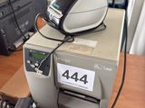 a printer sitting on top of a desk next to a printer