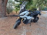a motorcycle that is parked on the side of the road