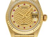 an image of a gold wrist watch with diamonds on the face