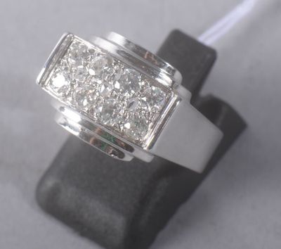 an image of a diamond ring on a stand
