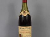 a bottle of wine that is sitting on a table