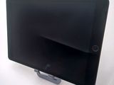 a tablet that is sitting on a stand on a table