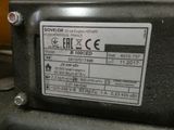 a label on the back of a machine that is sitting on a table