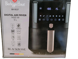 a black and silver coffee maker in the box