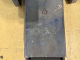 a close up of a piece of metal on a dolly