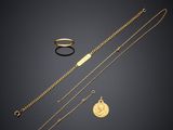 a collection of gold jewellery including a necklace, ring and bracelet