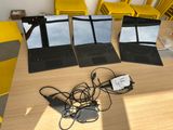 three laptops that are sitting on a table