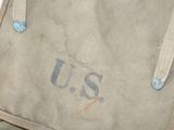 a bag with the word us on it sitting on a table