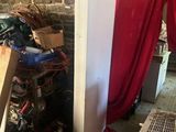 a refrigerator in a room with a red curtain on the wall