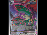 the pokemon card is displayed on a stand in front of a black background