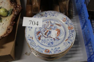 a lot of plates that are sitting on a shelf