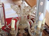 a chandelier that is sitting on a table in a room