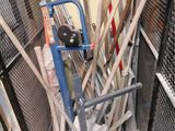 many baseball bats and baseball bats in a cage