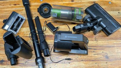many different types of vacuum cleaners on a wooden table