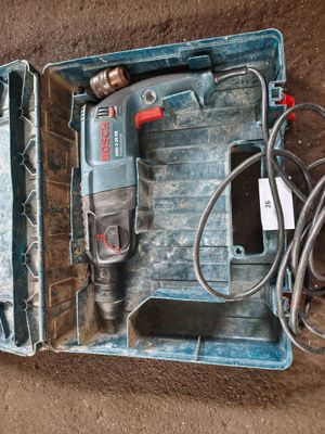 a drill in a case with a cord in it