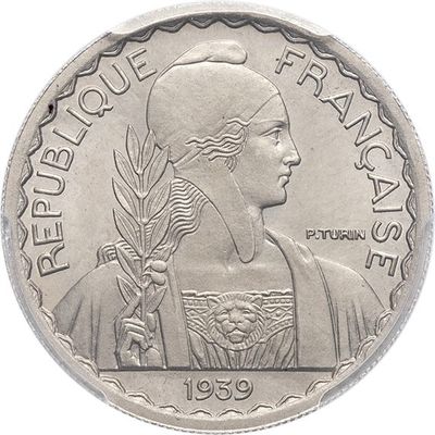 a close up of a coin on a white background with a picture of a woman
