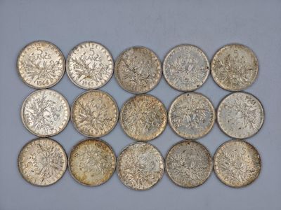 a bunch of silver coins sitting on top of a table