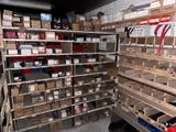 many boxes and boxes on the shelves in the room