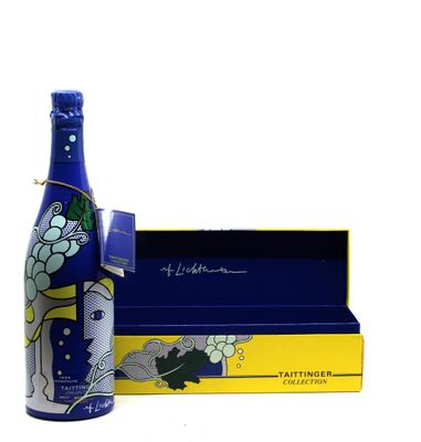 a bottle that is sitting next to a box
