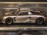 a silver model of a sports car in a display case