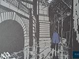 a picture of a man walking down the street