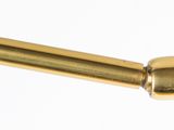 a gold toilet roll holder with a brass handle