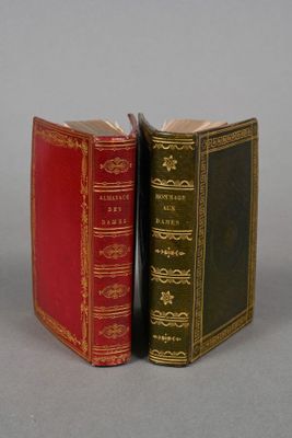 two books sitting next to each other on a table