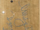 graffiti on the wall of a building with a fire hydrant in front of it