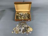 a suitcase full of coins sitting on a table