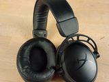 a pair of headphones sitting on a table next to a box