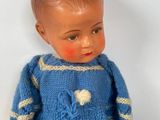 a small doll that is sitting on the floor