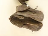 a baseball glove hanging on the wall with a ball in it
