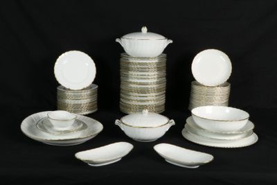 a lot of plates and bowls on a black background
