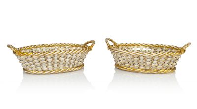 a pair of gold plated baskets with rope handles