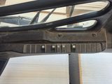 an image of a car dashboard with the door open
