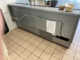 an image of a commercial kitchen with a sink and a counter