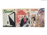 Trois livres sont alignés sur une surface blanche ; l'un représente un homme et l'autre une femme.
