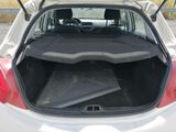 the back of a car with its trunk open and a mat in the trunk