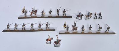 many figurines of people riding horses on a shelf